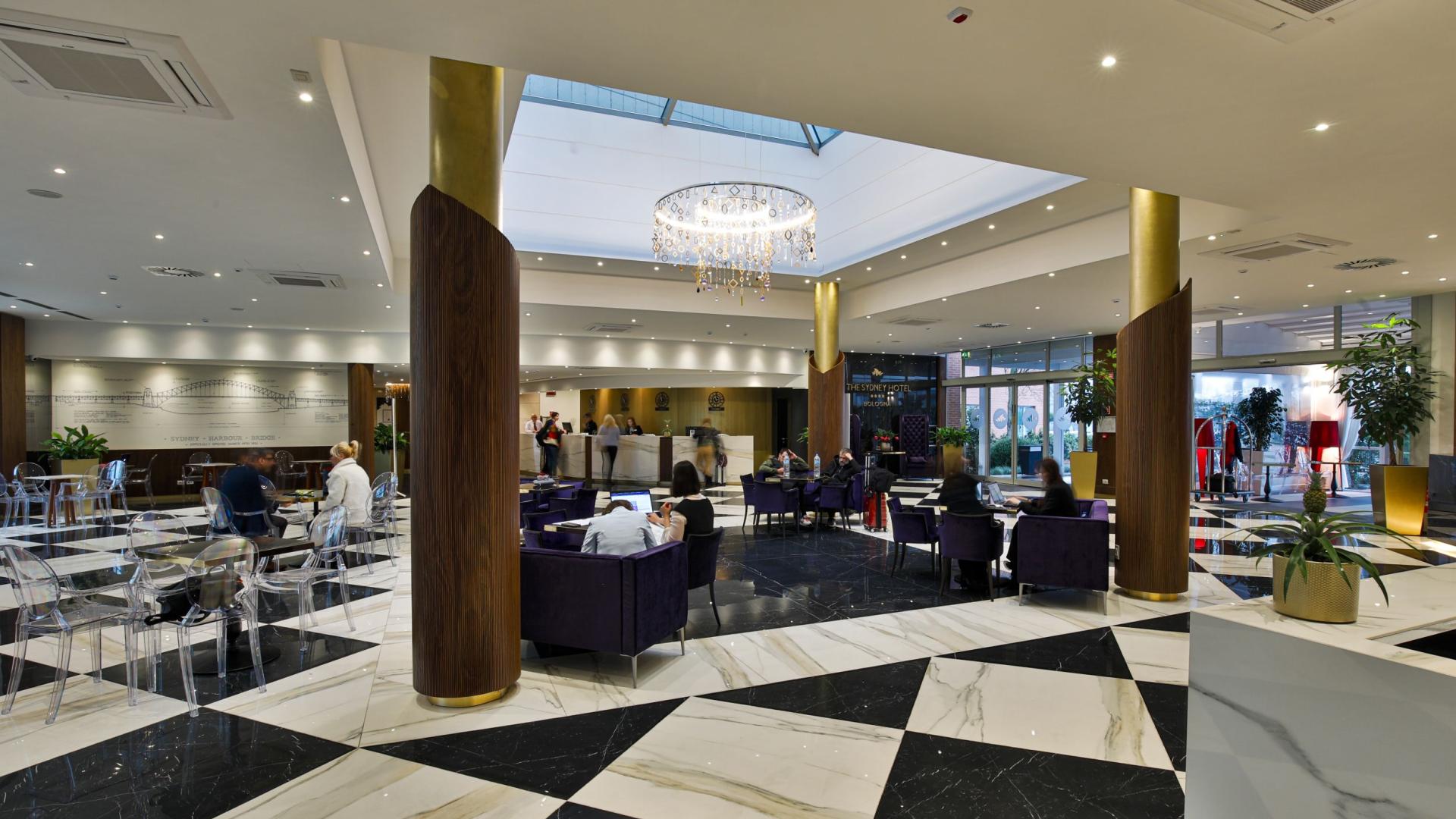 Elegant hotel lobby with modern furnishings and marble flooring.